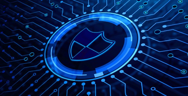 Shield security icon surrounded by a digital circuit pattern representing cybersecurity protection